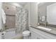 Bathroom featuring a shower-tub combo with decorative curtain, and vanity with neutral countertops at 9921 Pier Point Ter, Parrish, FL 34219