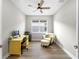 Bright office space with wood floors, a ceiling fan, a large window, and neutral tones at 9921 Pier Point Ter, Parrish, FL 34219