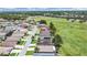Aerial view of the property featuring solar panels and a location adjacent to community ballfields at 2452 Big Pine Dr, Holiday, FL 34691