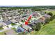 Aerial view of neighborhood featuring solar panels and proximity to the beach and community ballfields at 2452 Big Pine Dr, Holiday, FL 34691