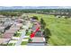 Aerial view of the property featuring solar panels and a location adjacent to community ballfields at 2452 Big Pine Dr, Holiday, FL 34691