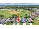 Aerial view of property, boasting a prime location near community ballfields and convenient amenities at 2452 Big Pine Dr, Holiday, FL 34691