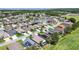 Aerial view of neighborhood featuring proximity to the beach, solar panels, and community ballfields at 2452 Big Pine Dr, Holiday, FL 34691