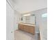 Clean bathroom with double vanity, shower-tub combination and abundant storage at 2452 Big Pine Dr, Holiday, FL 34691
