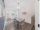 Charming dining room with hardwood floors, decorative lighting, and space for Gathering gatherings at 2452 Big Pine Dr, Holiday, FL 34691