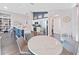 Eat-in kitchen featuring a center island, white cabinetry, stainless appliances, and eat-in table with seating at 2452 Big Pine Dr, Holiday, FL 34691
