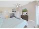 Spacious bedroom featuring vaulted ceilings, neutral carpet, and abundant natural light at 2452 Big Pine Dr, Holiday, FL 34691