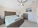 Relaxing main bedroom with a king bed, ensuite bathroom, and ample closet space at 2452 Big Pine Dr, Holiday, FL 34691