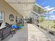 Wide-angle view of the screened patio with plenty of space for outdoor activities at 2452 Big Pine Dr, Holiday, FL 34691