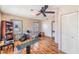 Spacious bedroom featuring wood-look floors, natural light, ceiling fan and closet at 1025 W Berry Ave, Tampa, FL 33603