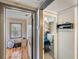 Hallway with views into a bedroom and laundry area with washer and dryer at 1025 W Berry Ave, Tampa, FL 33603
