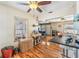 Bright dining room and living room features beautiful wood flooring and plenty of natural light at 1025 W Berry Ave, Tampa, FL 33603