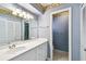The bathroom has a large vanity and cabinet storage at 10314 Lake Carroll Way, Tampa, FL 33618