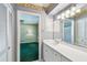 This bathroom features an open door leading to the bedroom at 10314 Lake Carroll Way, Tampa, FL 33618