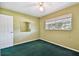 The bedroom features a mirror and window at 10314 Lake Carroll Way, Tampa, FL 33618