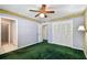 This bedroom features a ceiling fan and closet storage at 10314 Lake Carroll Way, Tampa, FL 33618