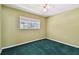 The bedroom has a window with an outside view at 10314 Lake Carroll Way, Tampa, FL 33618