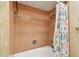 Classic shower with coral tiles, rainfall shower head, hand shower, and floral curtain at 10314 Lake Carroll Way, Tampa, FL 33618