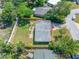 Aerial view of the home features a spacious yard, brick paved walkway and plenty of mature trees at 10821 101St Ave, Seminole, FL 33772