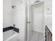 This is a bathroom featuring a tub with a shower head and a tile surround at 10821 101St Ave, Seminole, FL 33772