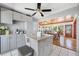 Bright kitchen featuring a granite island with seating and stainless steel appliances at 10821 101St Ave, Seminole, FL 33772