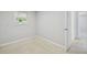 Cozy bedroom with neutral paint, a window, and white trim at 1153 Honor Dr, Holiday, FL 34690
