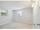 Bedroom with neutral walls, carpeted floor, and two windows providing natural light at 1153 Honor Dr, Holiday, FL 34690