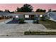 Charming single story home with covered parking, beautiful trees, and mature landscaping at 1153 Honor Dr, Holiday, FL 34690