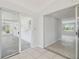 Hallway featuring sliding glass doors and tiled flooring for easy transition between spaces at 1153 Honor Dr, Holiday, FL 34690