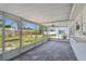 Enclosed patio with tile floor, ceiling fan, and views of the backyard at 1153 Honor Dr, Holiday, FL 34690