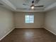 Bedroom featuring wood-look tile flooring, a tray ceiling and a window at 12021 Coleman Ave, Port Charlotte, FL 33981
