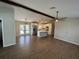 Modern kitchen with white cabinets, stainless steel appliances, and a large island open to the living area at 12021 Coleman Ave, Port Charlotte, FL 33981