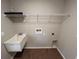 Laundry room featuring a utility sink and storage shelf at 12021 Coleman Ave, Port Charlotte, FL 33981