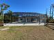 Screened-in pool offers privacy and a space for outdoor enjoyment with a patio and yard at 12021 Coleman Ave, Port Charlotte, FL 33981