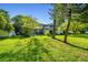 Spacious backyard offering a picturesque view of the property, perfect for outdoor activities at 1236 Abbey Crescent Ln, Clearwater, FL 33759