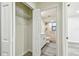 The closet reveals a stylish bathroom with modern fixtures and accessible features at 1236 Abbey Crescent Ln, Clearwater, FL 33759