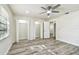 A light filled bedroom features wood-look flooring and a closet at 1236 Abbey Crescent Ln, Clearwater, FL 33759