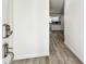 Inviting foyer with fresh paint and sleek, modern flooring leading into the kitchen at 1236 Abbey Crescent Ln, Clearwater, FL 33759