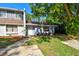 Inviting townhome featuring manicured landscaping and a welcoming entrance at 1236 Abbey Crescent Ln, Clearwater, FL 33759