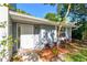 Inviting townhome entrance with landscaped yard, and a secure door with a coded lock at 1236 Abbey Crescent Ln, Clearwater, FL 33759