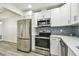 This kitchen boasts stainless steel appliances and modern finishes at 1236 Abbey Crescent Ln, Clearwater, FL 33759