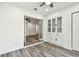 Open room with wood-look floors, french doors, and built in cabinets at 1236 Abbey Crescent Ln, Clearwater, FL 33759