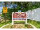 Community entrance sign for Harvard Arms Townhomes in a deed restricted, no soliciting neighborhood at 1236 Abbey Crescent Ln, Clearwater, FL 33759
