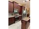 Modern kitchen featuring stainless steel appliances, granite countertops, and ample cabinet space at 12619 50Th E Ct, Parrish, FL 34219