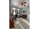 Well-lit office with tile flooring, and a treadmill for exercise at 12619 50Th E Ct, Parrish, FL 34219