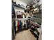 Walk-in closet with wire shelving, storage for clothes, shoes and personal items at 12619 50Th E Ct, Parrish, FL 34219