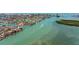 A luxurious waterfront home with a private dock and lush greenery, offering an ideal coastal lifestyle at 12650 7Th E St, Treasure Island, FL 33706
