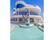 Backyard pool with stunning modern architecture and a sculpture that enhances its appeal at 12650 7Th E St, Treasure Island, FL 33706