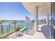 Balcony with water view and a plunge pool showing a bright sunny day at 12650 7Th E St, Treasure Island, FL 33706