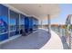 Large outdoor balcony overlooking waterfront property with plenty of room for comfortable seating at 12650 7Th E St, Treasure Island, FL 33706